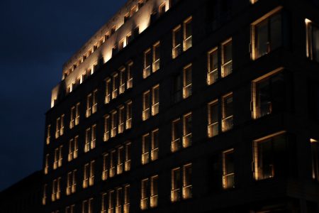 Modern building windows at night - free stock photo