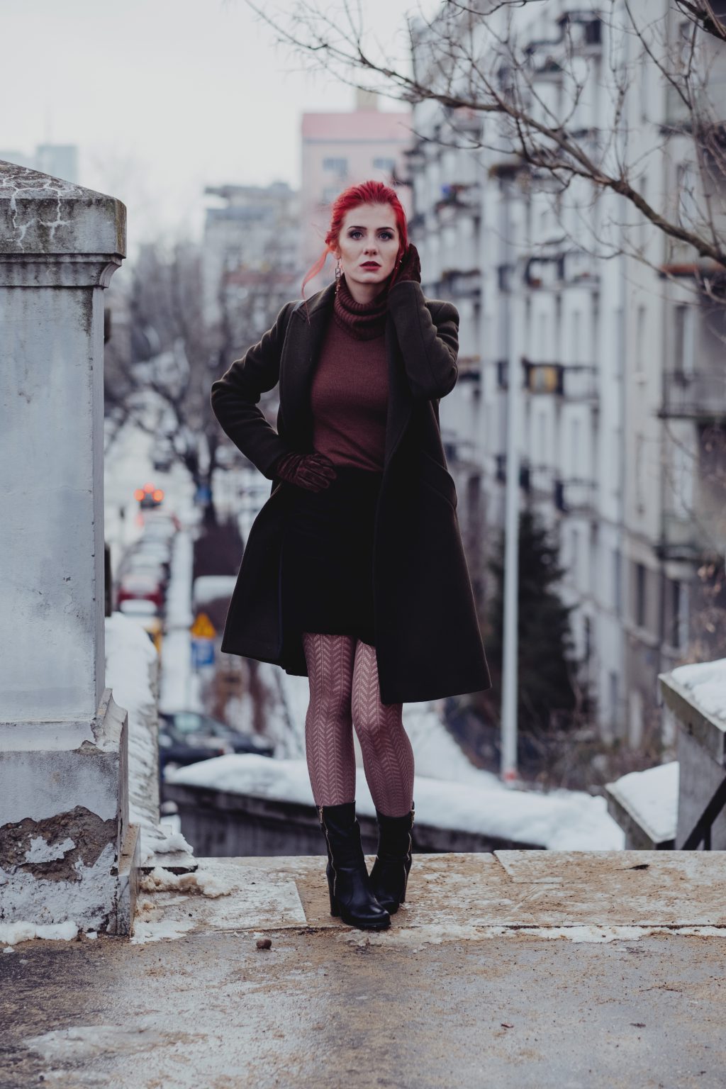 Redhead woman posing in th city - free stock photo