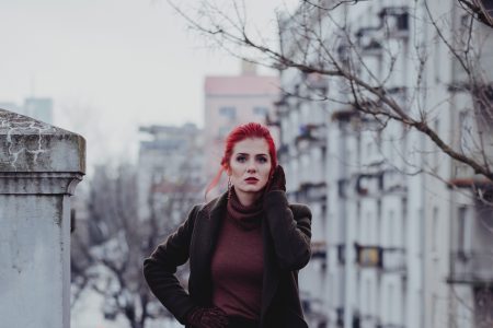 Redhead woman posing in th city - free stock photo
