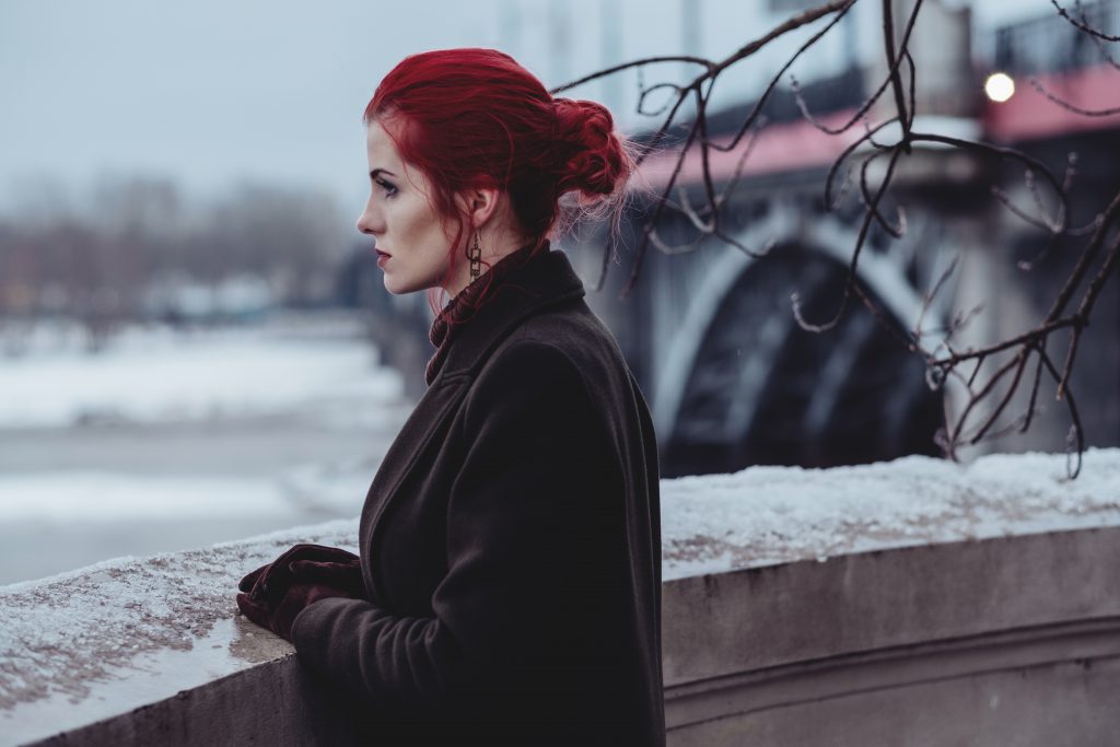 Redhead woman posing in th city 2 - free stock photo