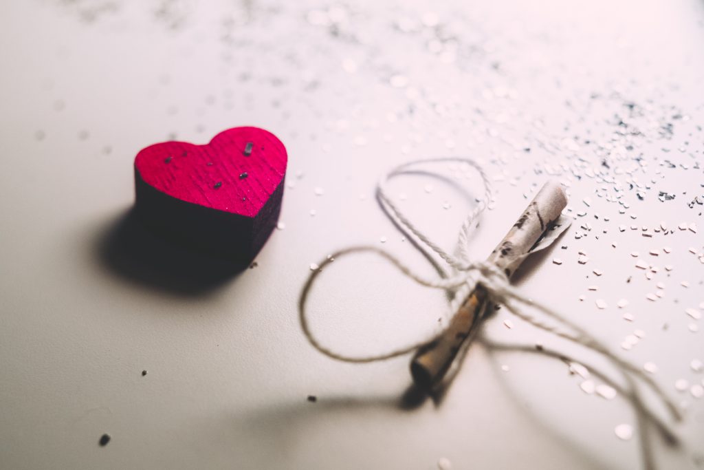 Tiny letter and a wooden heart - free stock photo