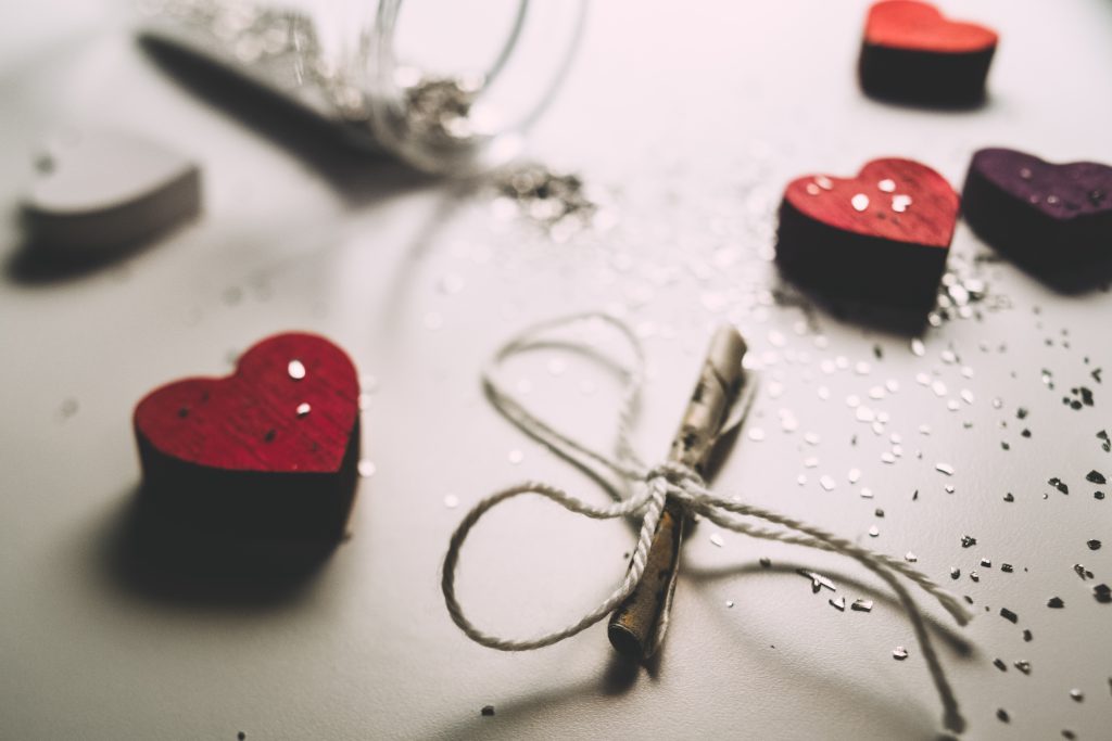 Tiny letter and wooden hearts - free stock photo