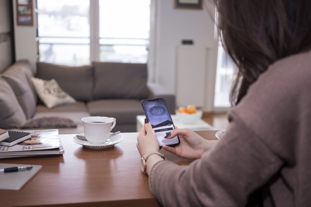 A female holding an iPhone X 2 - free stock photo