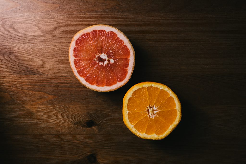 Grapefruit and orange cut in half - free stock photo