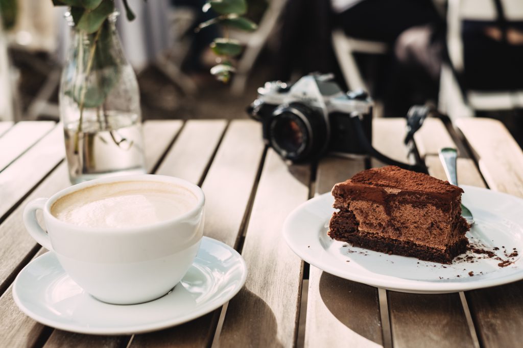 Coffee, chocolate cake and an analog camera - free stock photo