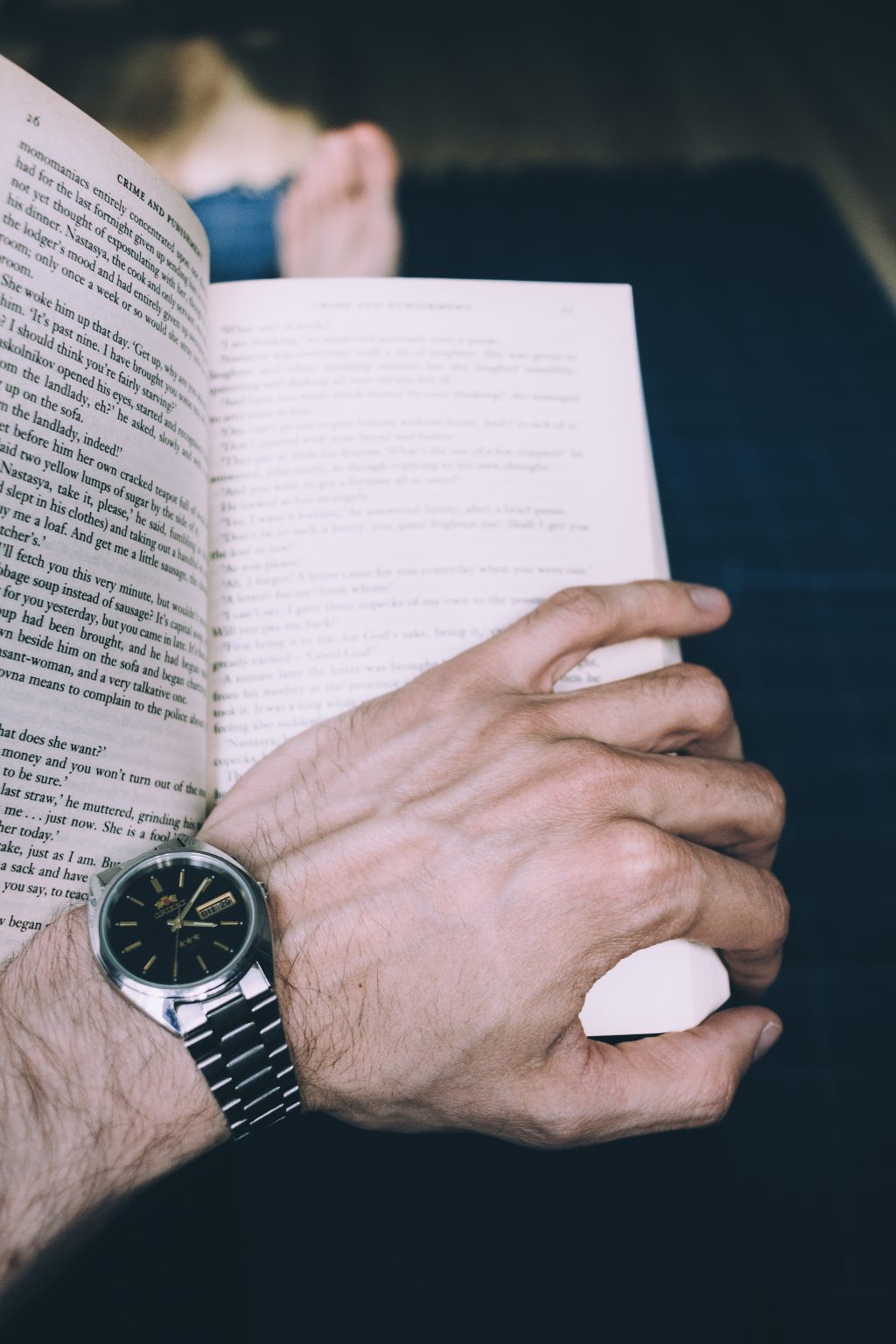 Male hand holding an open book 2 - free stock photo