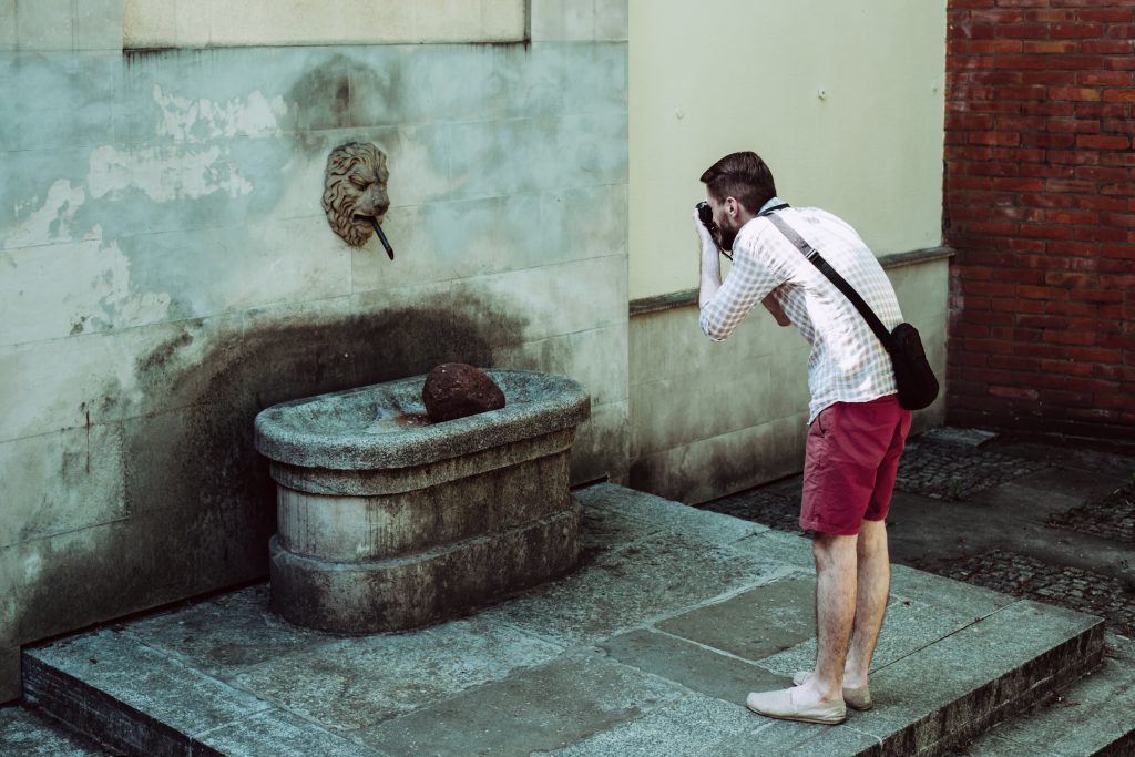 Male tourist taking a picture - free stock photo