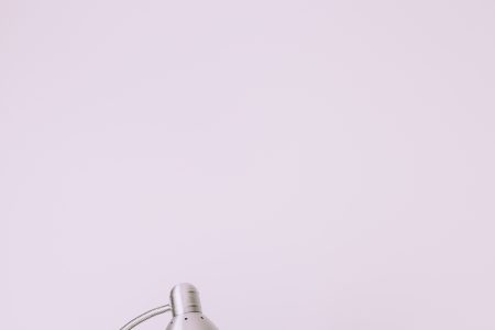Metal desk lamp and books pile - free stock photo