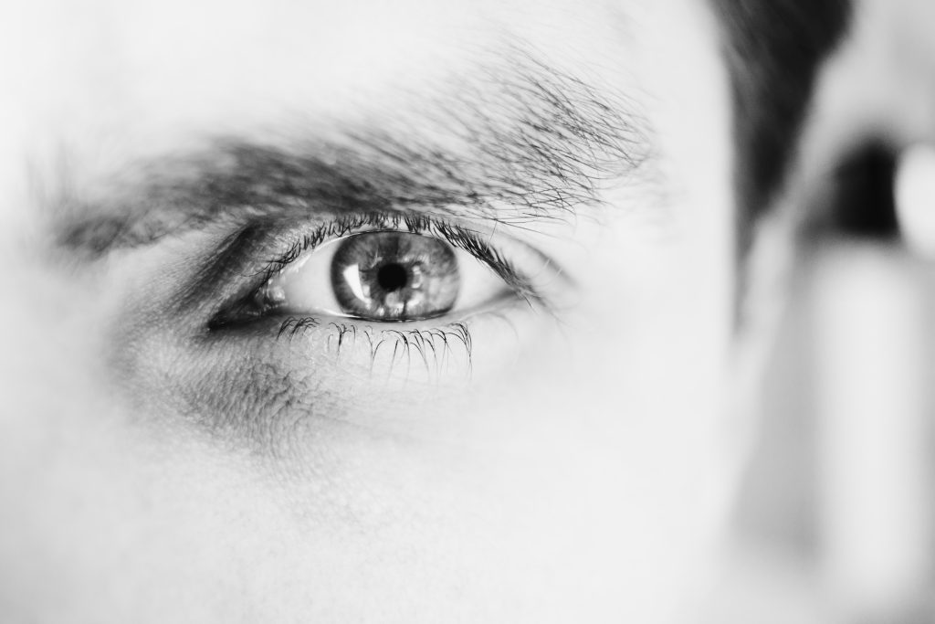 single male eye in black and white