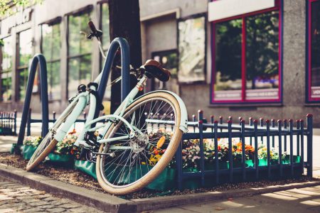 Vintage bicycle leaning against a bike rack 3 - free stock photo