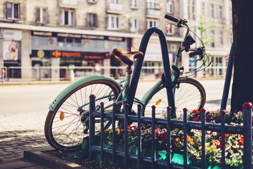 Vintage bicycle leaning against a bike rack 2 - free stock photo