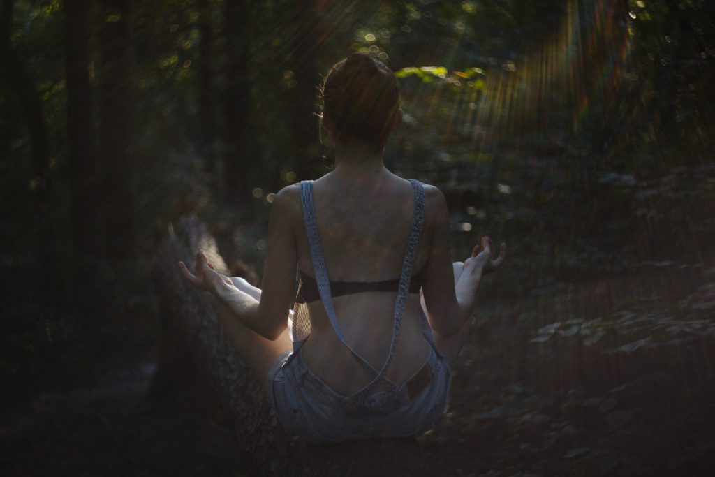 Helios shot of a girl meditating - free stock photo