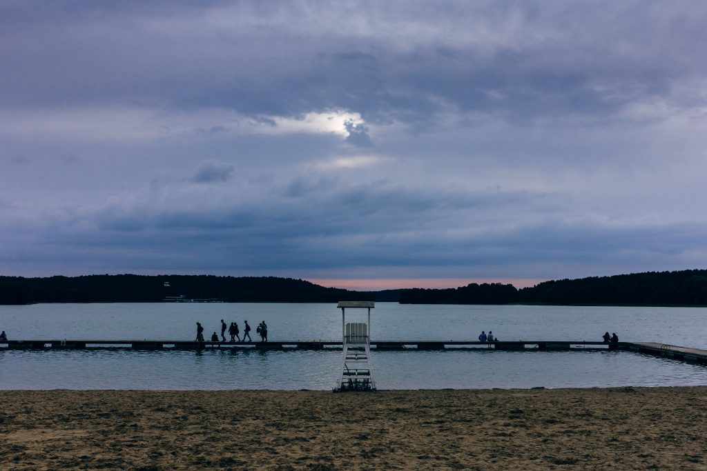 people_standing_on_the_pier_at_dusk-1024x683.jpg