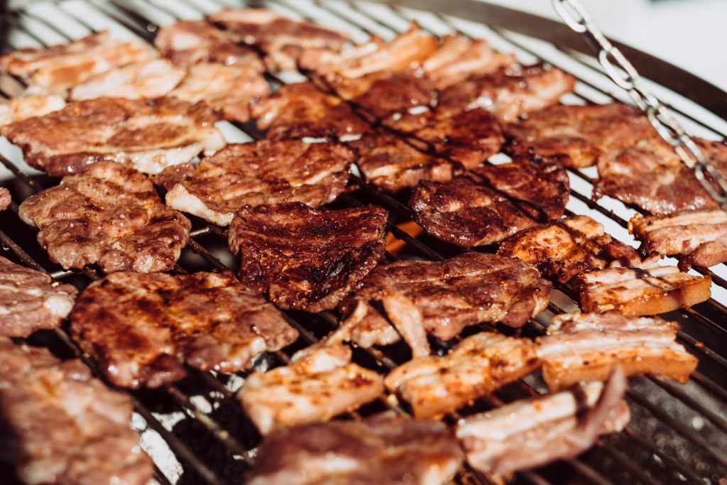 Pork and bacon on the grill closeup - free stock photo