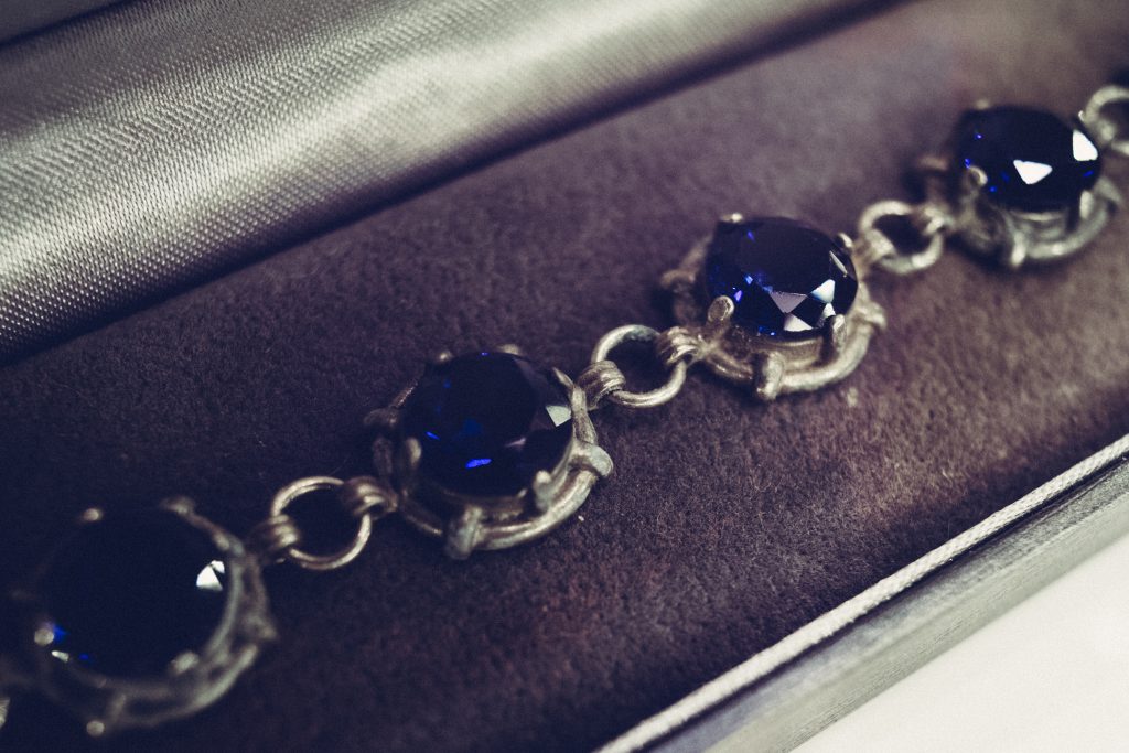 Silver bracelet with blue gems closeup - free stock photo
