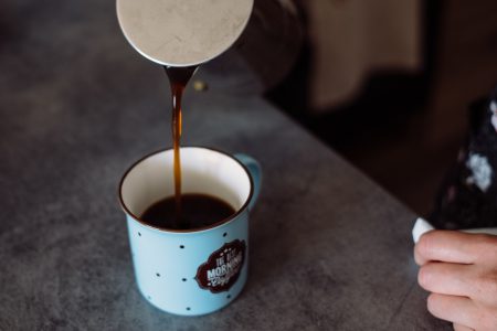 Pouring coffee from a percolator - free stock photo