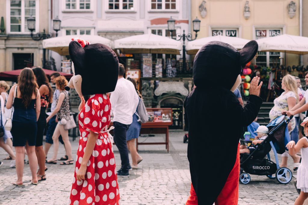 Mickey and Minnie waving at tourists - free stock photo