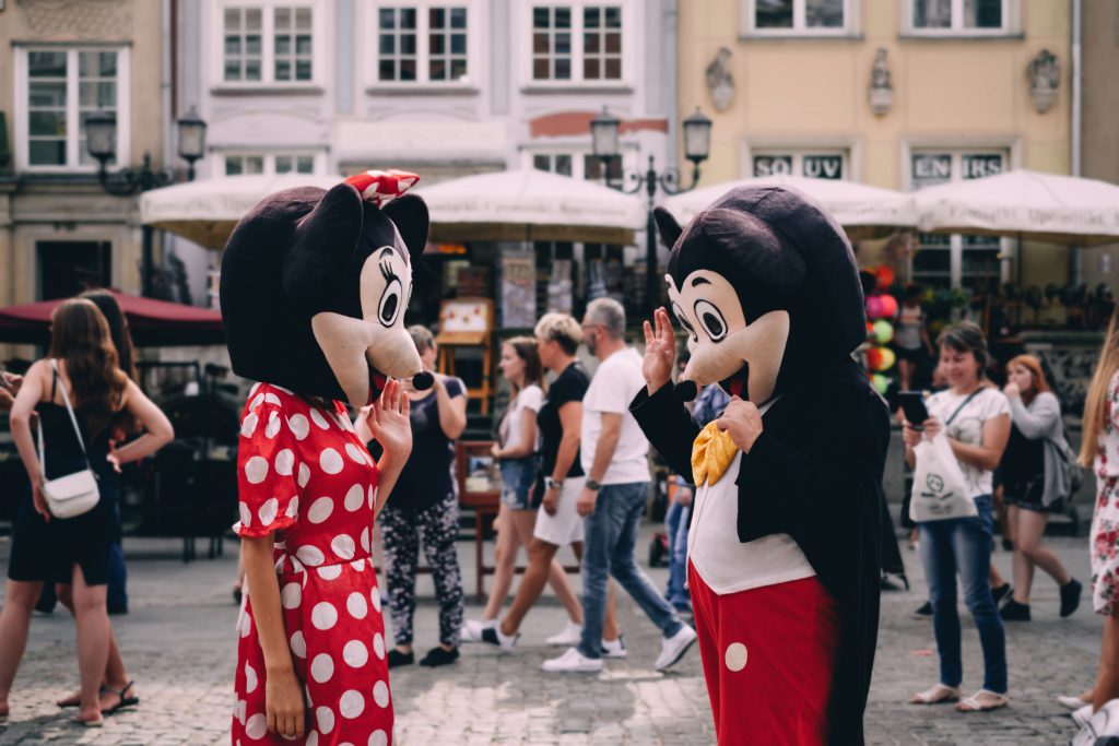 Mickey and Minnie waving at tourists 2 - free stock photo