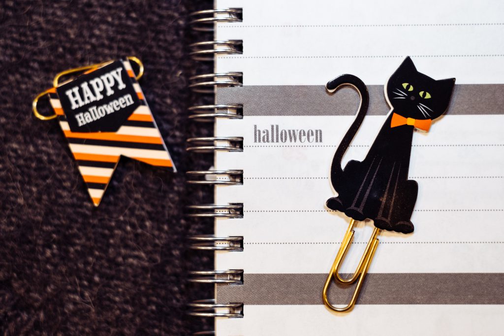A black cat and Happy Halloween paperclips - free stock photo