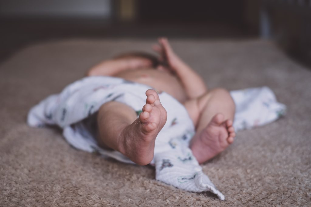 newborn_baby_lying_down_on_the_mattress-1024x683.jpg