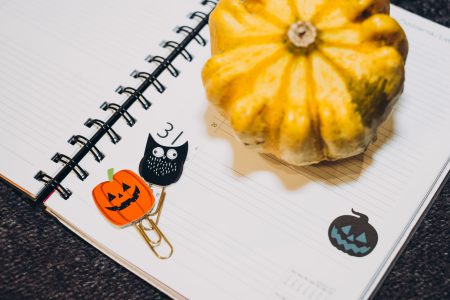 A pumpkin and an owl paperclips in a calendar - free stock photo