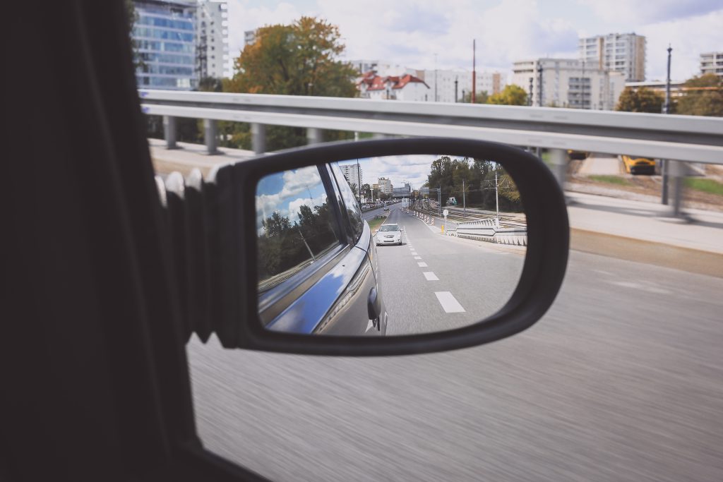 Reflection in a car side mirror - free stock photo