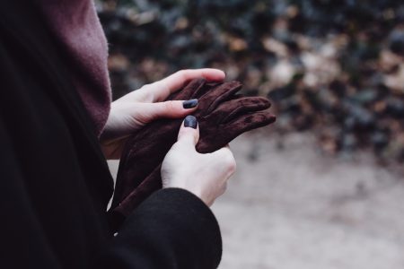 Female hands holding leather gloves - free stock photo