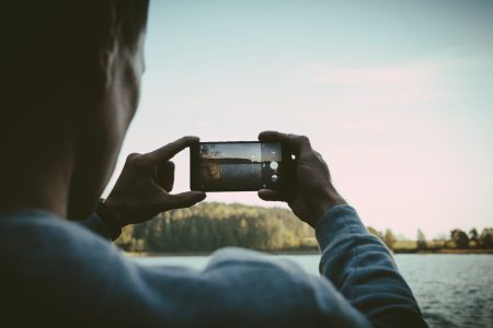 Man taking a picture with his cellphone - free stock photo