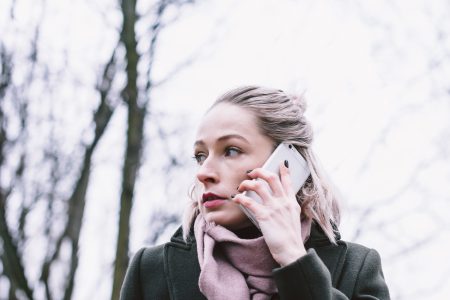 Young woman talking on the phone outdoors - free stock photo