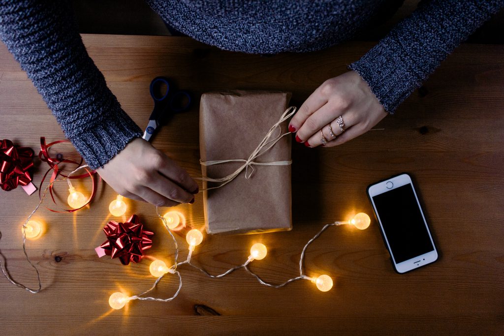 Female decorating a gift 2 - free stock photo