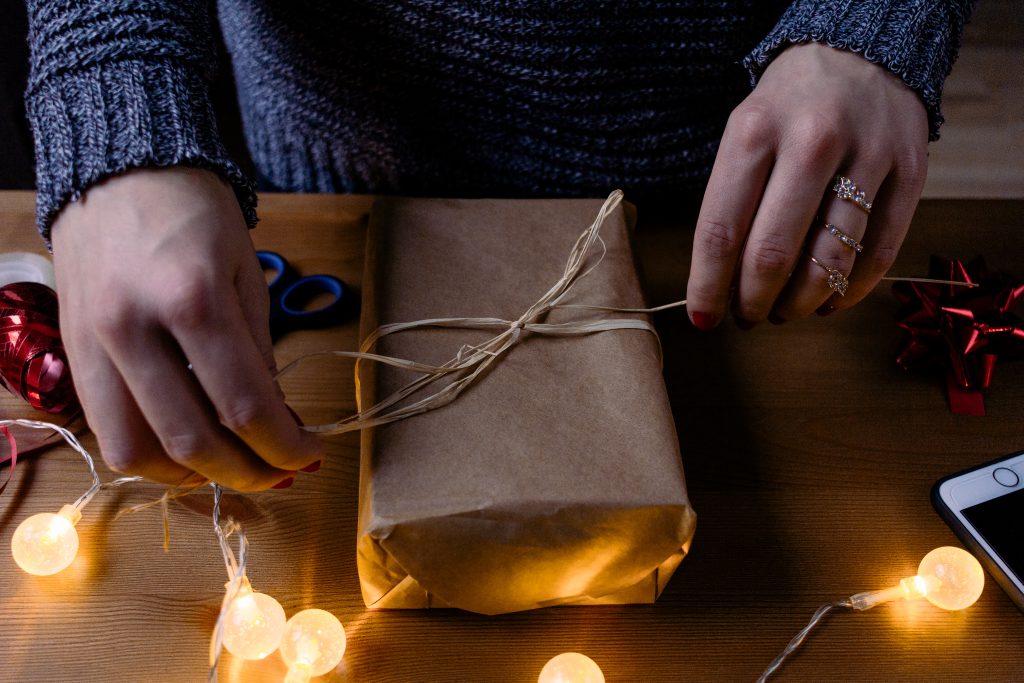 Female decorating a gift 3 - free stock photo