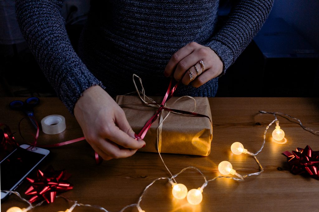 A female decorating a gift 4 - free stock photo