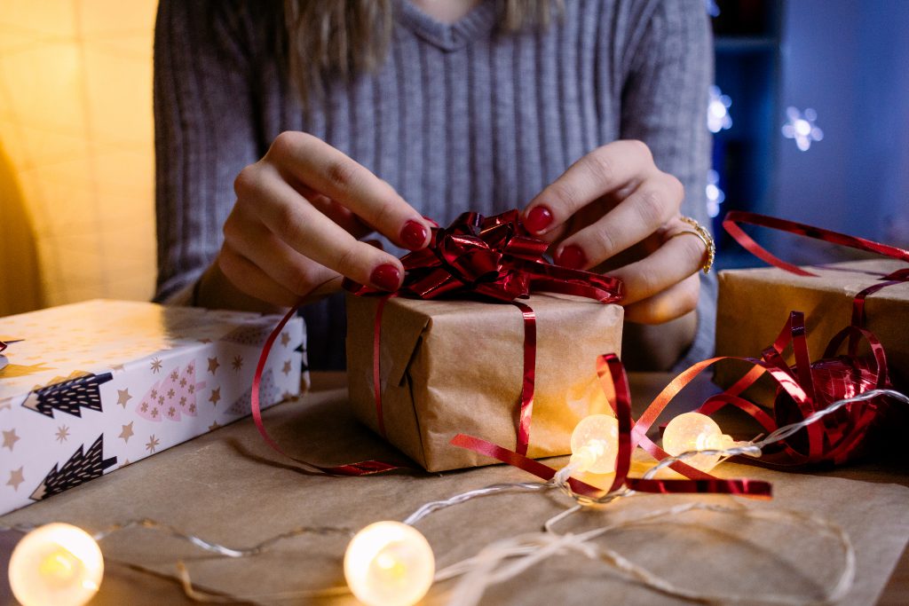 A female decorating a gift 5 - free stock photo