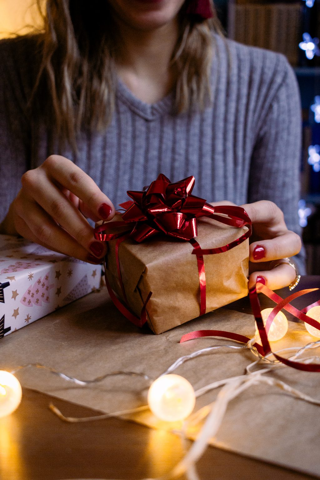 A female decorating a gift 6 - free stock photo