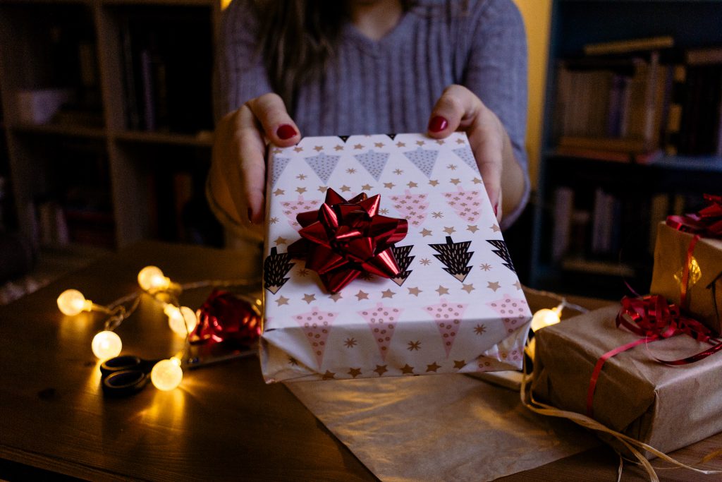 female_holding_a_christmas_gift_3-1024x683.jpg