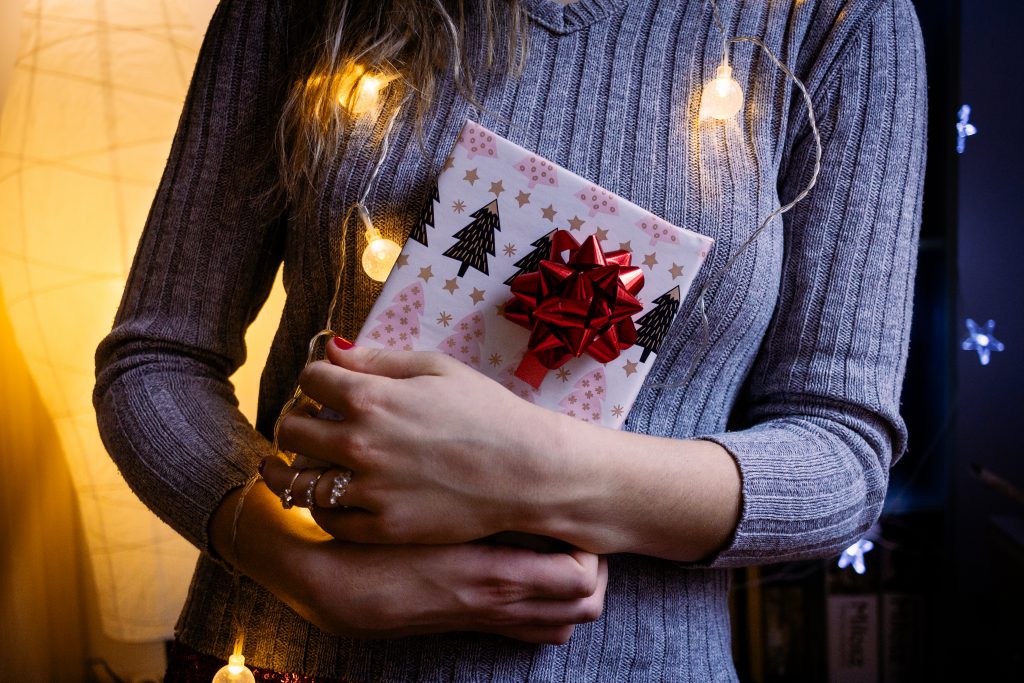 female_holding_a_christmas_gift_4-1024x683.jpg