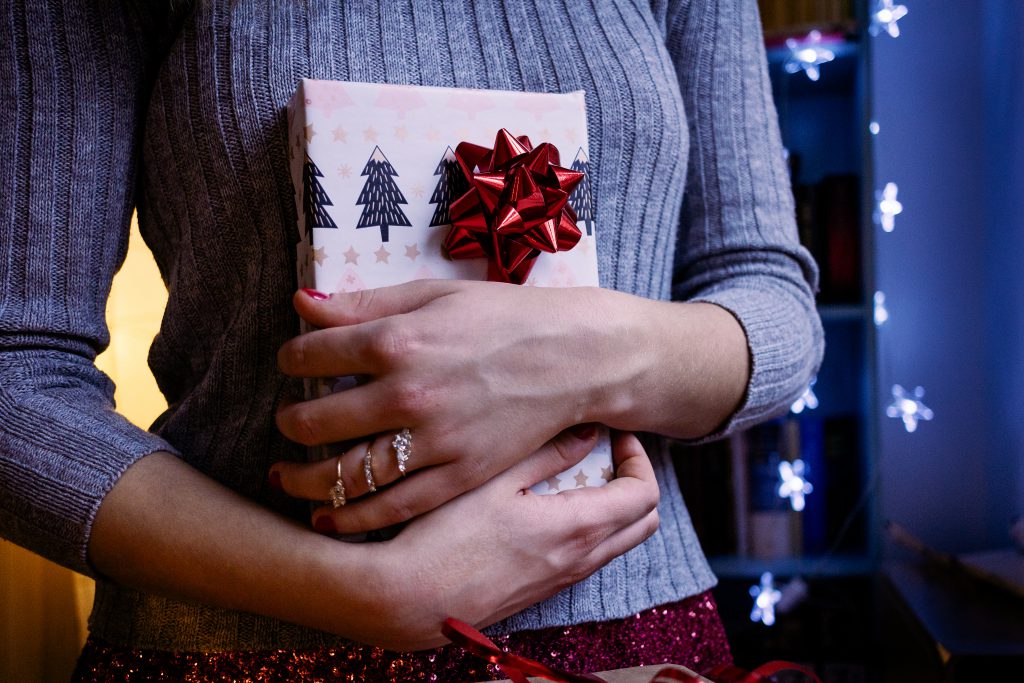 A female holding a christmas gift 5 - free stock photo