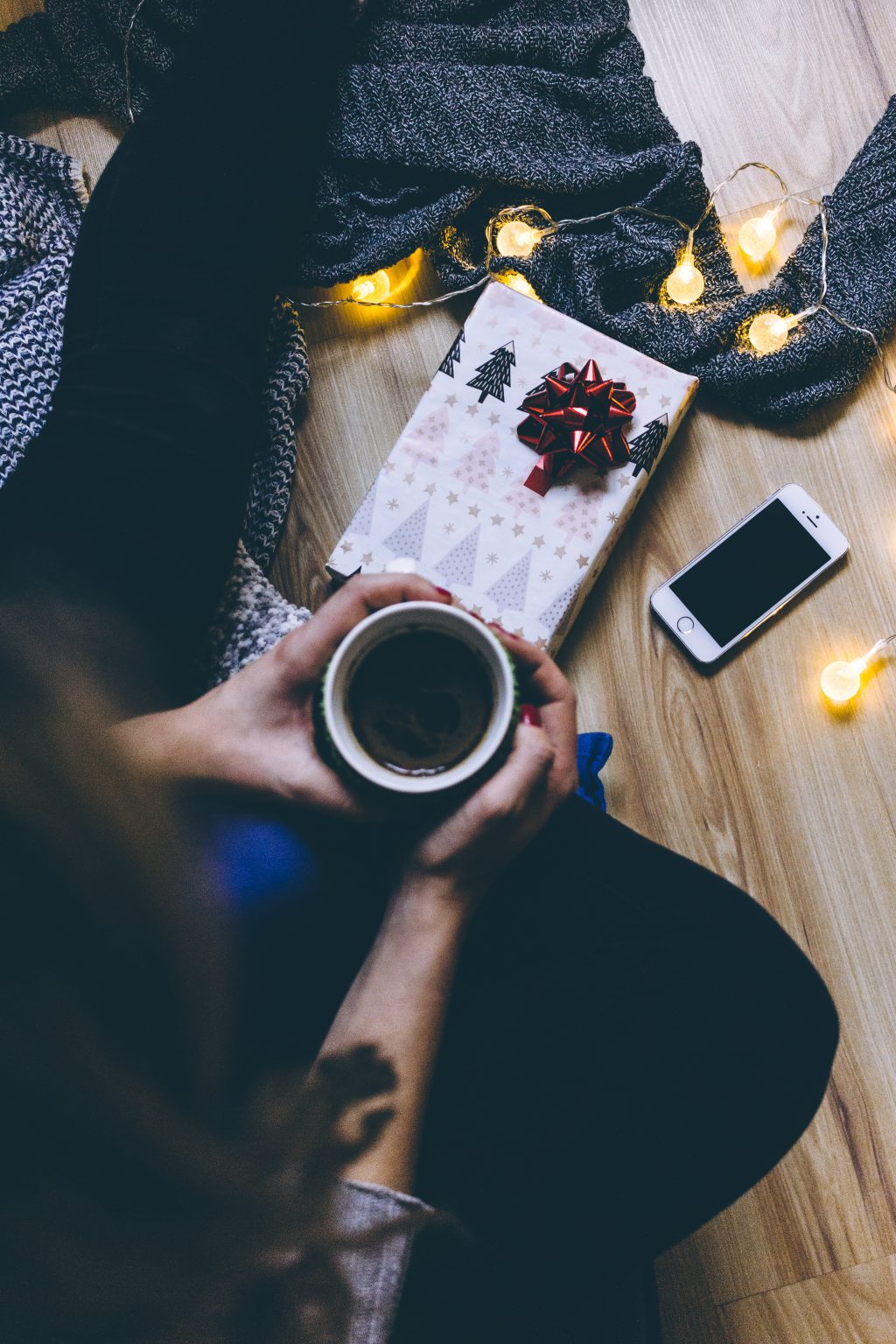 A female holding a mug in a festive setting 3 - free stock photo