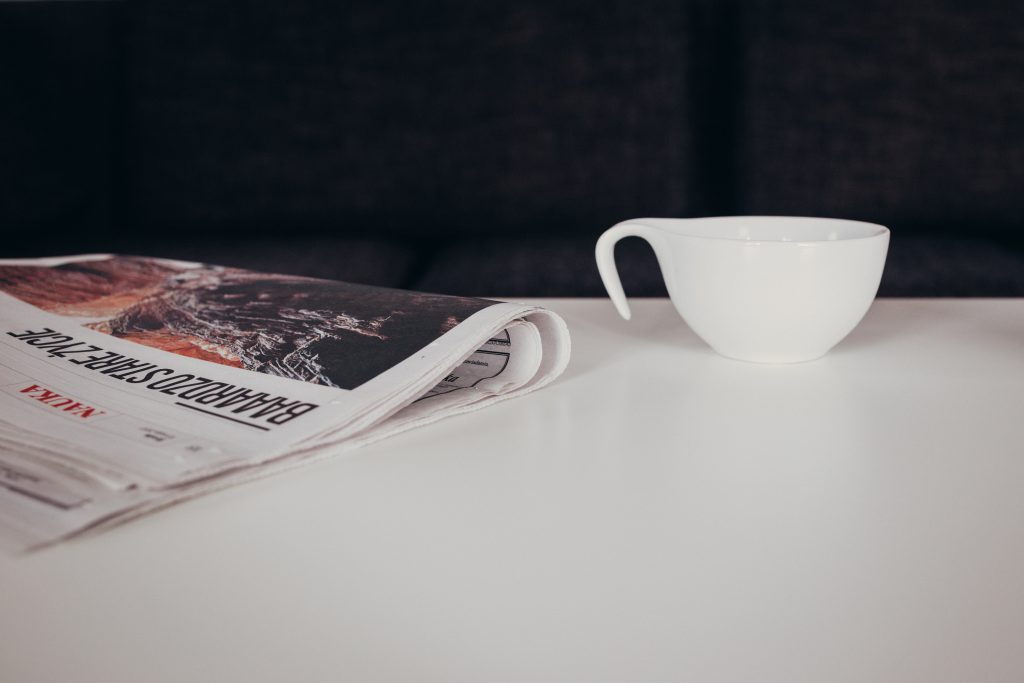 cup_of_coffee_and_a_newspaper_on_the_tab