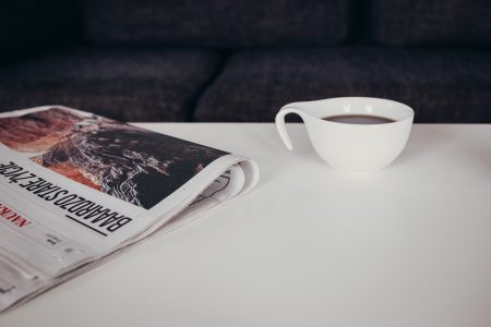 Cup of coffee and a newspaper on the table 2 - free stock photo