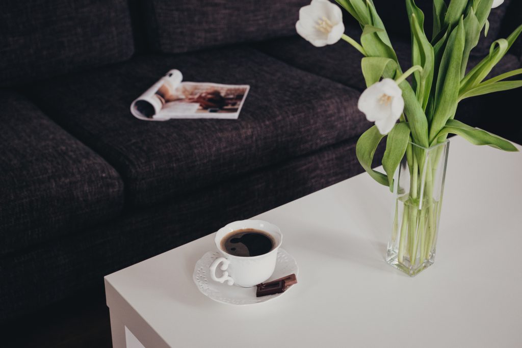 Cup of coffee and tulips on the table - free stock photo