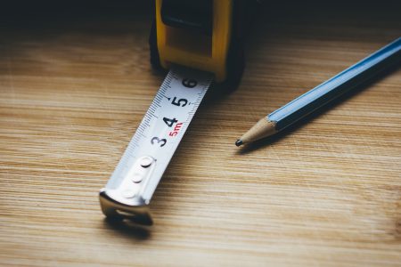 Metal tape measure tool and a pencil - free stock photo