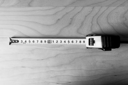 Metal tape measure tool in black and white - free stock photo