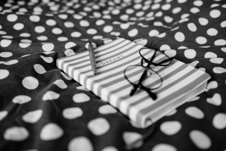 Dreams notebook and glasses - free stock photo