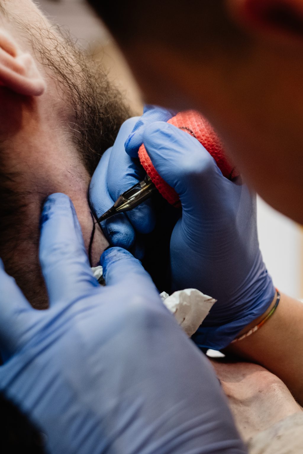 Tattoo artist at work closeup 3 - free stock photo