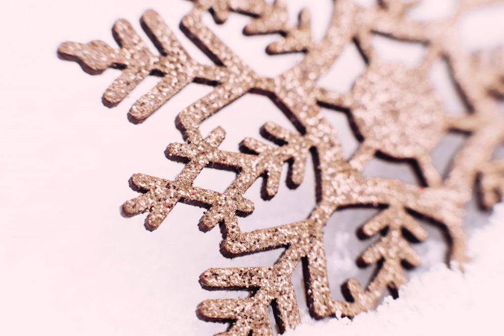Gold glitter snowflake closeup - free stock photo