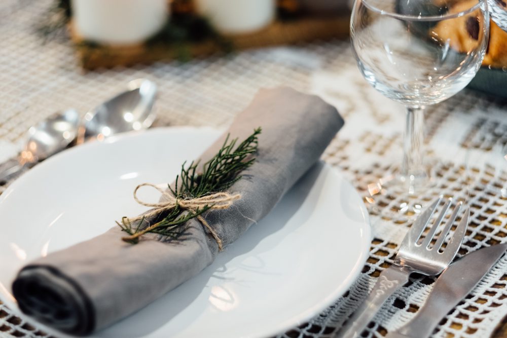 Linen napkin decorated with a conifer twig 2 - free stock photo
