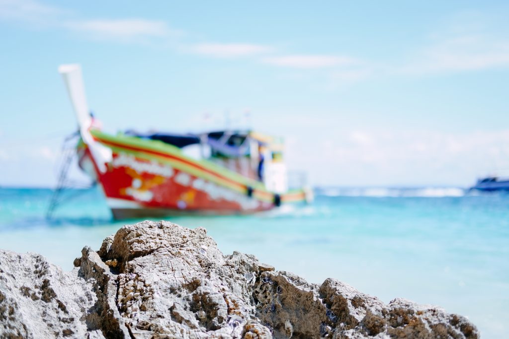 A blurry boat at the beach in Thailand - free stock photo