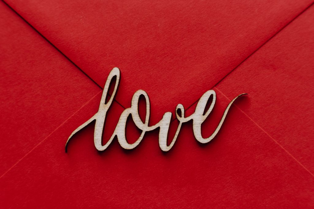 wooden_word_love_on_a_red_envelope-1024x683.jpg