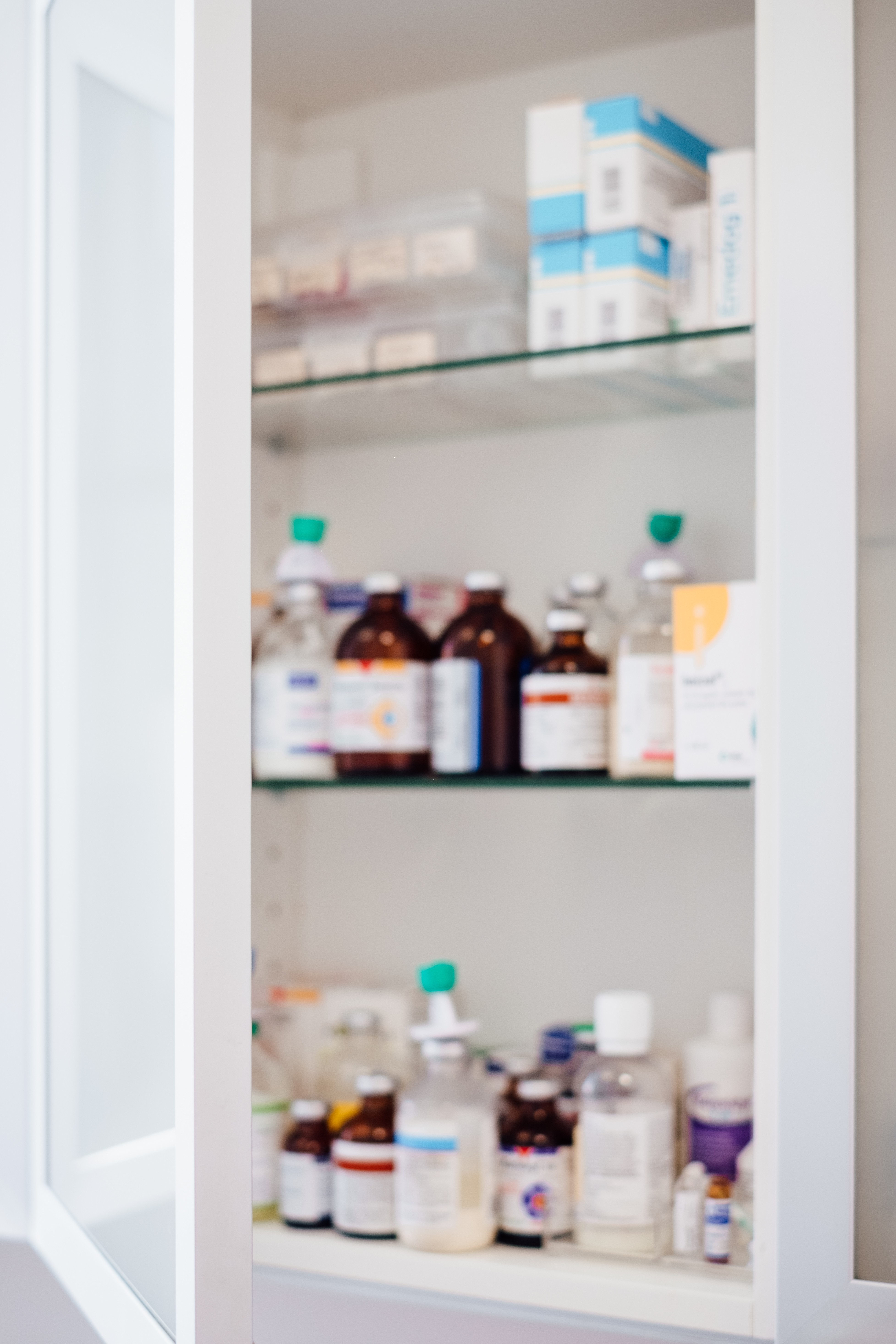 Medicine Bottles in Row on Storage Shelf Stock Image - Image of